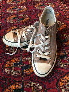well-worn Converse trainers